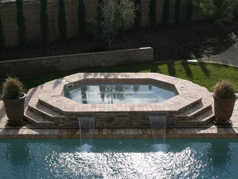Spillover spas to add to your pool by Refreshing Pools & Spas, INTL, LLC